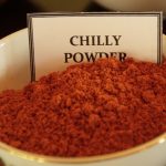Herbal Demonstration red Chilli Powder in a white bowl