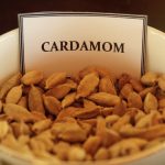 Cardamom in a white clay bowl